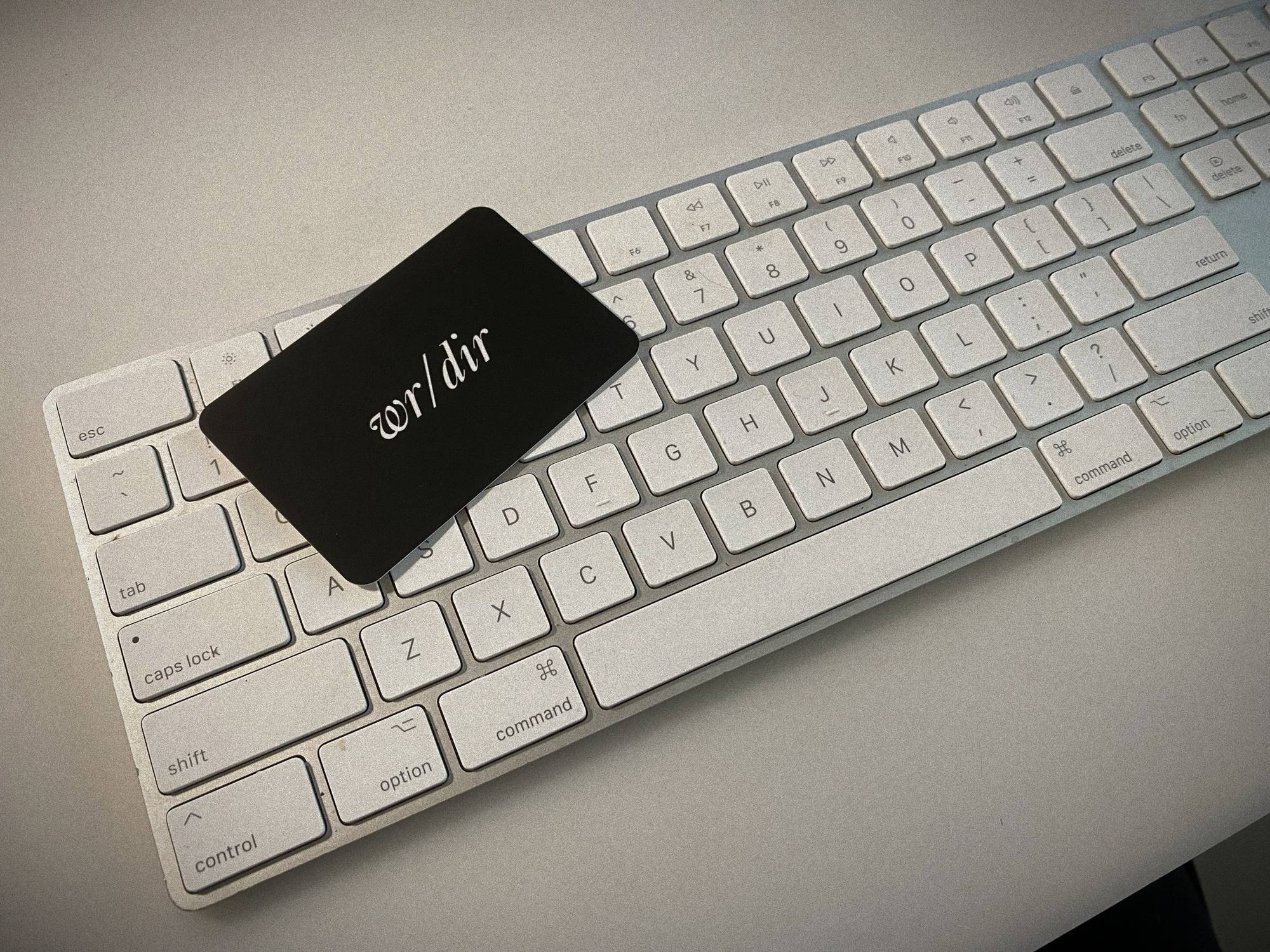 A writer/director business card on a keyboard