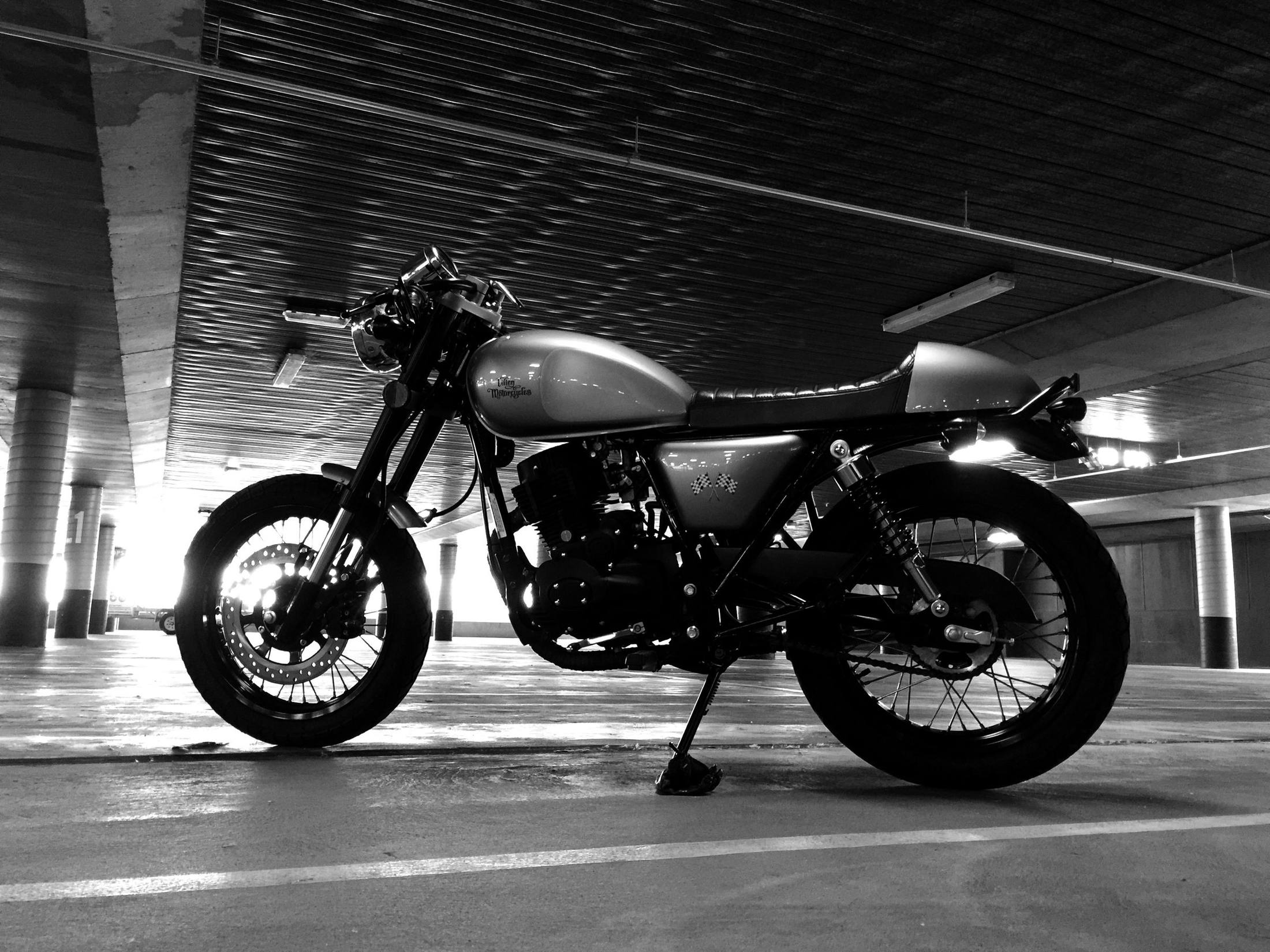 Nigel's motorbike in a car park