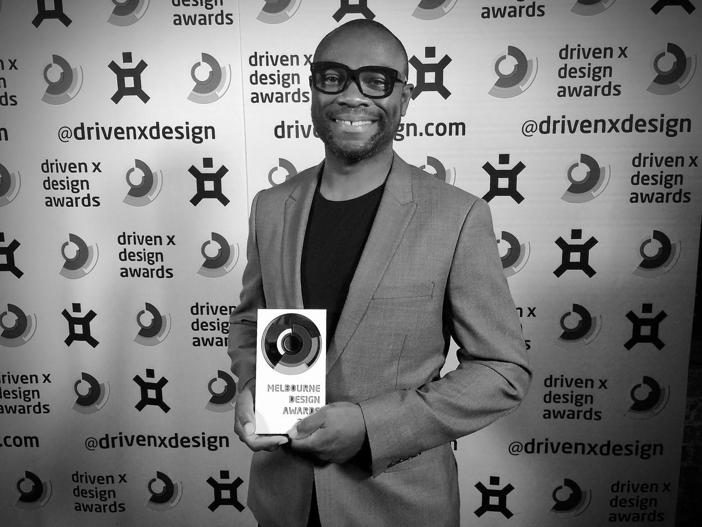 Nigel holding the Melbourne Design Awards gold medal